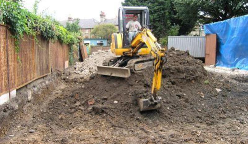 Mini digger working on an excavation